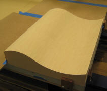 The edges were veneered using clamps and cauls; the face was veneered in the vacuum press.