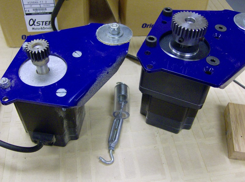 The new geared motor with the larger 25 tooth pinion is on the right.