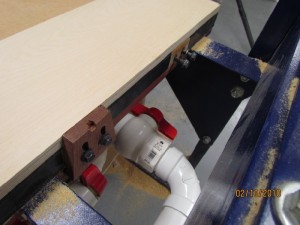 My original stops consisted of slotted hardwood blocks which were bolted to the edges of the table with threaded inserts. They worked well enough for several years but proved to be too cumbersome for day to day production.